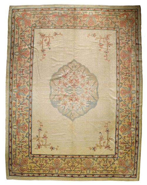 EUROPEAN ART NOUVEAU CARPET, ca. 1910.Beige central field with a floral central medallion and corner motifs in attractive pastel colours, yellow border, signs of wear, 310x400 cm.