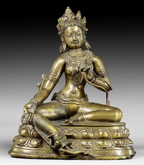 AN EARLY WELL MODELLED BRONZE FIGURE OF THE GREEN TARA. Tibet, 13th/14th c. Height 20.5 cm.