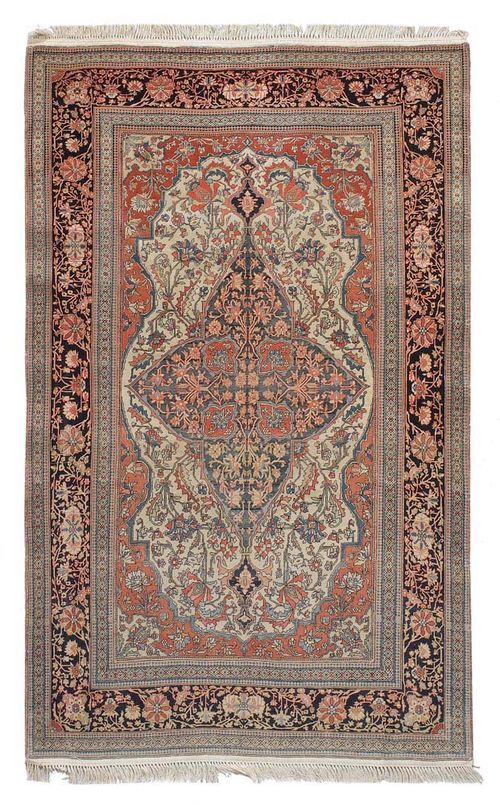KESHAN MOHTASCHEM antique.Attractive collector's item with a central medallion on a white and red with plant motifs in harmonious colours, black border, signs of wear, fringes replaced, 210x130 cm.