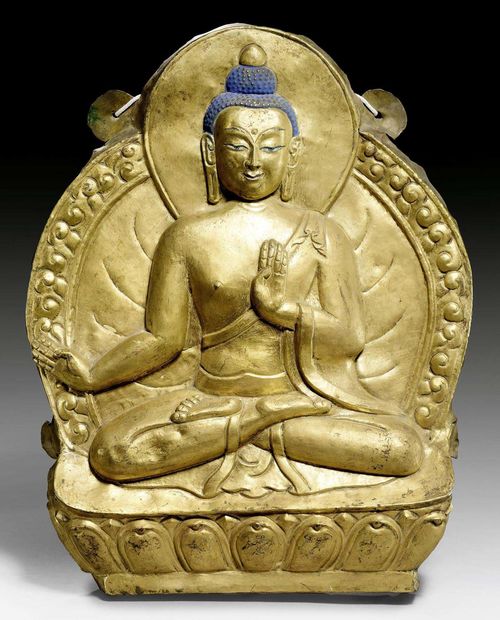 A GILT COPPER REPOUSSÉ RELIEF OF A BUDDHA. Tibet, 18th c. Height 44 cm.