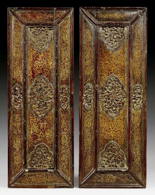 A PAIR OF CARVED AND LACQUERED SUTRA COVERS WITH GOLD LACQUER LOTOS SCROLLS. Tibet, ca. 18th c. Length 71, hight 26.5 cm.