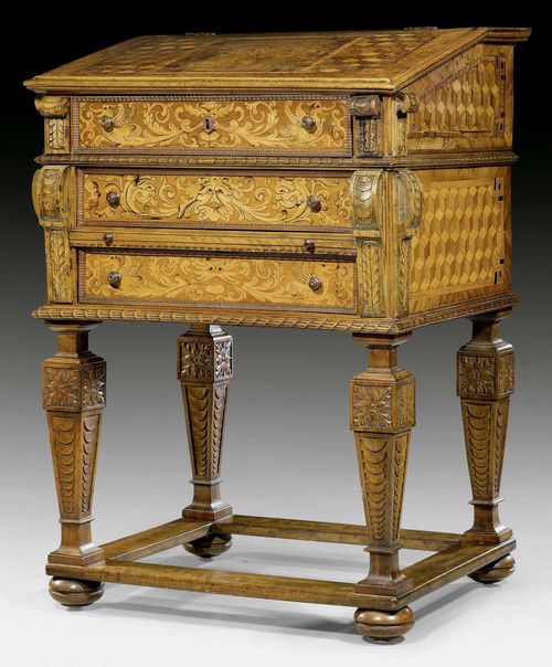 STANDING DESK,Baroque, German, 18th century and later. Finely carved walnut and fruitwoods, inlaid with parquetry, flowers, leaves and frieze. Hinged top and fitted interior of drawers and compartments. Wooden knobs. 82x57x120 cm. Provenance: - From a Swiss castle collection.