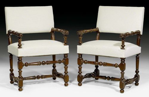 PAIR OF FAUTEUILS,Louis XIII, France circa 1700. Shaped walnut carved with stylized foliage. Off-white fabric cover. 60x44x50x94 cm.