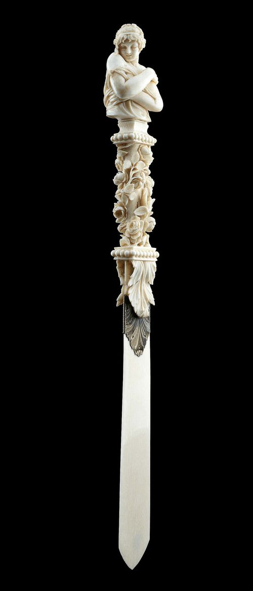 A FINE IVORY PAPERKNIFE, possibly Dieppe, circa 1890. Ivory finely and partly openwork carved with a female bust, rose garlands and acanthus leaves, silver band in the shape of 2 acanthus leaves. Flattened, pointed blade. L 36 cm.