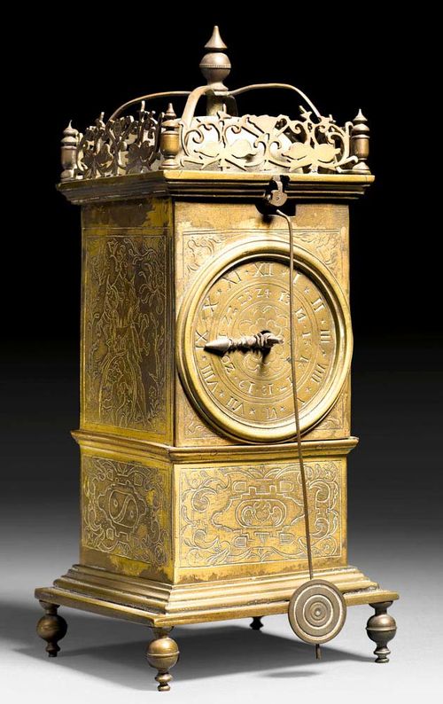 TOWER CLOCK WITH FRONT ZAPPLER,Renaissance, Germany , 17th century Bronze and brass with remains of old gilding. The clock with a brass dial and iron mechanism and striking on bell. Requires servicing. 80x8x18 cm. Provenance: from an important German private collection.