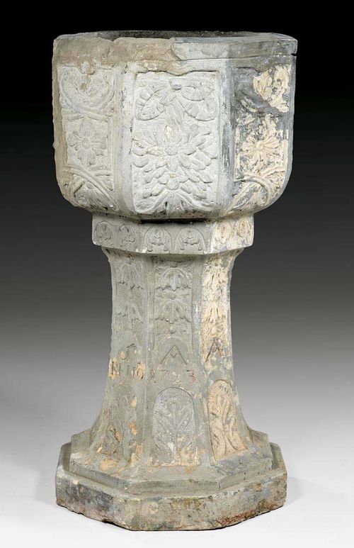 STONE BAPTISMAL FONT, Baroque, dated 1723, German. Relief carved and with remains of old gilding Some chips. H 105 cm. Provenance: Swiss private collection.