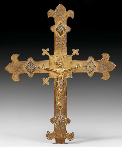 PROCESSIONAL CROSS,Limoges, early 13th century. Engraved and gilt bronze  with enamel rhombuses. One of the cross leaves missing from the central rectangular attachment. Corpus Christi in gilt copper. H 40, W 32 cm.