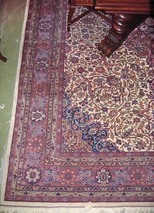 INDO TABRIZ old. White ground with a pink central medallion and blue corner motifs, the entire carpet is patterned with stylised trailing flowers, pink border, slight wear, 360x275 cm.