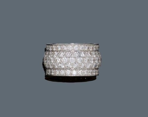 DIAMOND RING, CARTIER. White gold 750. Broad, slightly convex band ring, set throughout with 123 brilliant-cut diamonds weighing ca. 3.40 ct. Signed Cartier, No. 978076. Size 53. With case.