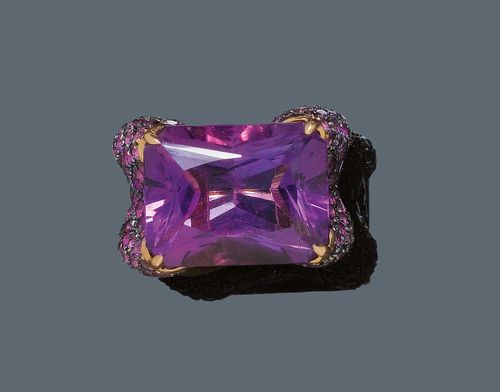 AMETHYST RING, ADOLFO COURRIER. Pink gold 750, partially blackened, 33g. Very decorative, large ring. The top set with an octagonal amethyst of ca. 29.00 ct and of fine colour, set throughout with ca. 150 small amethysts, 1 is missing, weighing ca. 6.00 ct. Size 54. From the estate of Charlotte and Egon Karter-Sender, Basel.
