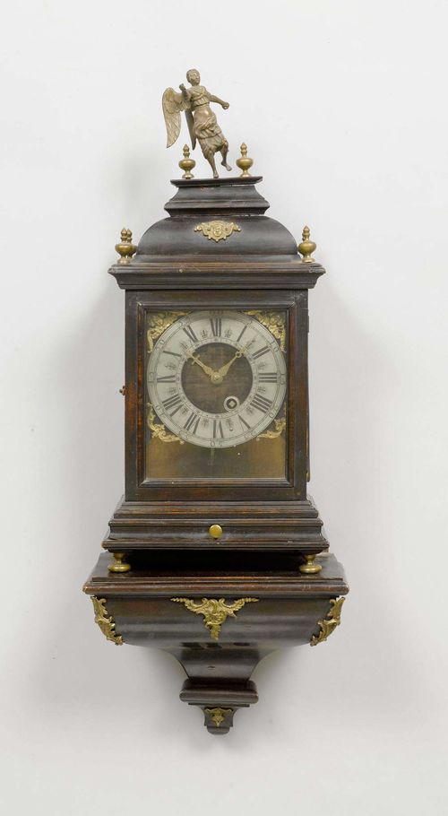 A LOUIS XIV CLOCK, probably Neuchâtel. Blackened wood. Fronton lined with dark velvet, engraved brass chapter ring. Movement with verge escapement striking the hours on bell. H 85 cm. Requires restoration.