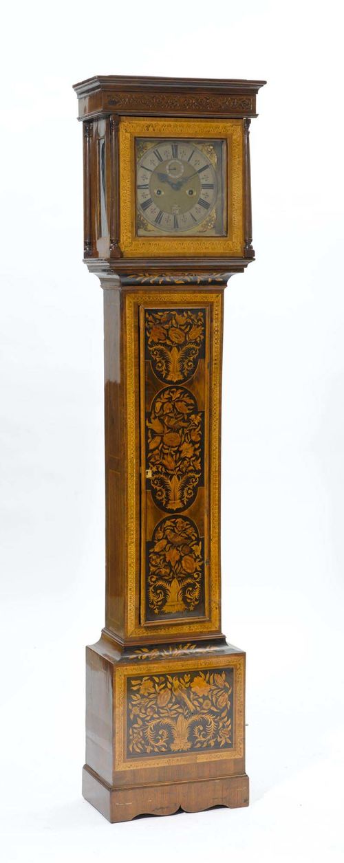 LONG-CASE CLOCK WITH SECOND, DATE AND DAY,London, 18th century. Signed "FROMANTEEL". Walnut, burlwood and various other woods inlaid with flowers, birds, friezes and carved with leaves. Partially engraved brass fronton with metal chapter ring. Verge escapement and 1/2-hour strike on bell. H 207 cm. Pendulum missing.