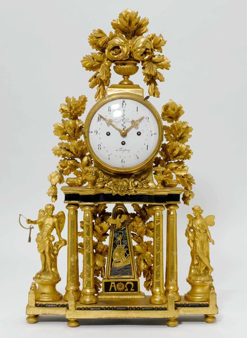 LARGE PORTAL CLOCK WITH DATE,late Louis XVI, Austria, 19th century. The dial signed "WENZEL RUNDT IN FREYBERG". Wood, carved and gilt. White enamel dial. Movement with 3/4-hour strike on 2 bells (can be turned off). H 78 cm. Some losses and alterations, movement requires servicing.