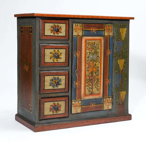 SMALL PAINTED "SCHAFREITE" CUPBOARD,Toggenburg, in the style of the late 18th century. Pinewood, painted with flowers and grapes. The front with a door and 4 drawers. 98x44x95 cm.