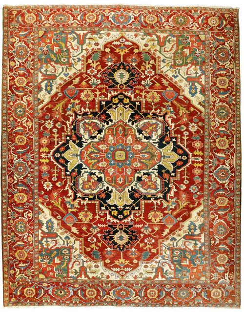 HERIZ SERAPI antique.Attractive piece in very good condition. Large central medallion in pink, white and black on a red ground with white and green corner motifs, typically patterned, red border, 390x307 cm.