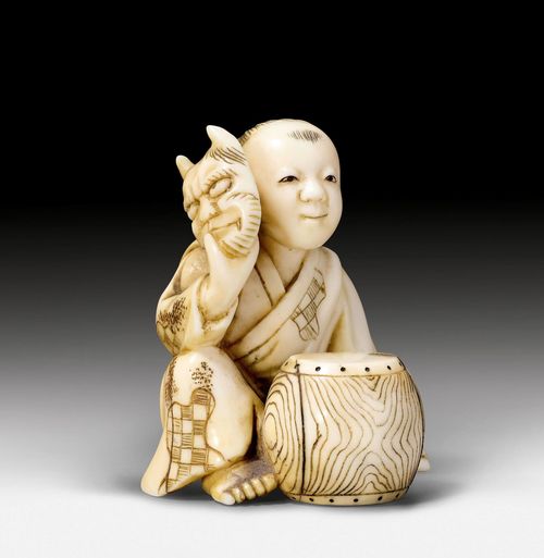 A SMALL IVORY OKIMONO OF A BOY WITH AN ONI MASK AND A DRUM. Japan, late 19th c. H 4.4 cm.