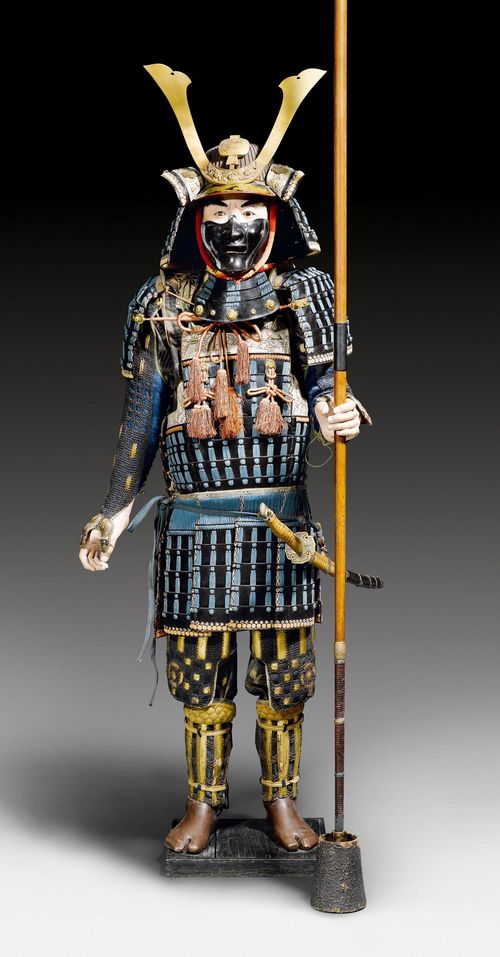 A SAMURAI ARMOUR (YOROI). Japan, late Edo. With sword, wooden staff, displayed on a Japanese dummy.