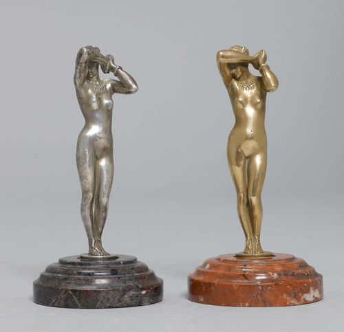 PAIR OF STATUETTES,bronze, one silver-plated. Standing female nude. On a round marble base. H 12.5 cm.