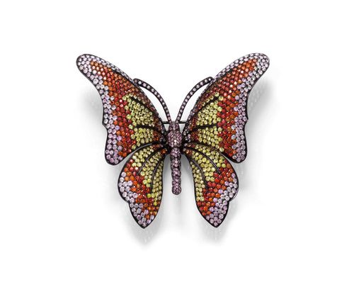 SAPPHIRE BROOCH. Silver, blackened, 32g. Decorative, large brooch designed as a butterfly, set throughout with numerous, treated multicolour sapphires, colour graduated. 217 yellow, 411 pink and 283 orange sapphires weighing ca. 28.70 ct in total. Ca. 7 x 7.9 cm. With case.