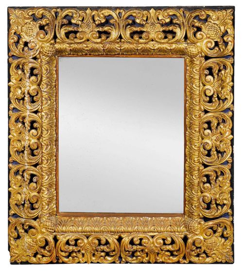 IMPORTANT MIRROR,Baroque, Italy circa 1700. Richly carved and parcel gilt wood. H 104 cm, W 88.5 cm. Provenance: Baron Kuhlmann-Stumm collection in Schloss Ramholz, Germany.