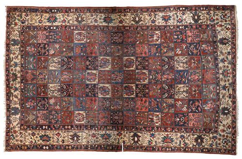 BACHTIAR GARDEN CARPET, old.Central field divided into squares, decorated with plant motifs in attractive colours, white border, good condition, small cut to be restored, 570x370 cm.