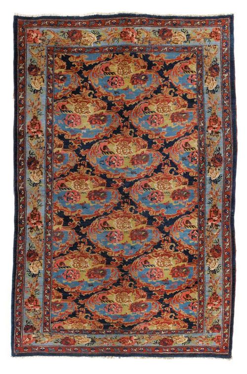 BIDJAR antique.Black central field, honeycomb patterned with rose medallions in shades of blue and pink, turquoise border, good condition, 200x134 cm.