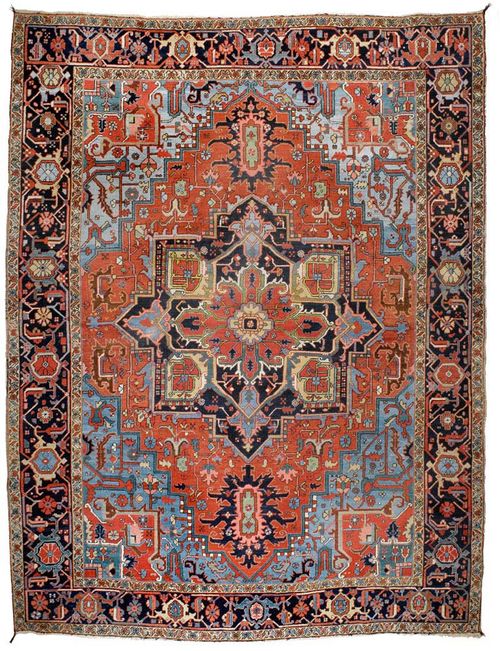 HERIZ antique.Bulky central medallion on a red ground with blue corner motifs, typically patterned, black border, signs of wear, 370x280 cm.
