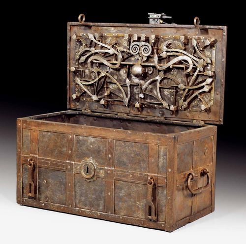 LARGE IRON COFFER,Renaissance, German circa 1680. Wrought iron. With overhanging lid and compartment, finely engraved iron lock and ornamental bands. 97x50x46 cm. Provenance: Château de Vincy, West Switzerland.