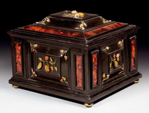 JEWELLERY CASKET,late Renaissance, partly from old elements. Florence. Ebonised wood inlaid with red tortoiseshell and "Pietra Dura". The lid with mirror inside. Lined with blue silk and with removable compartment. Gilt bronze mounts. 36x32x25 cm. Provenance: - from a German private collection. - Galerie Koller Zurich on 9.9.1999 (Lot No. 1525). - Private collection, Lugano. A fine high quality casket.