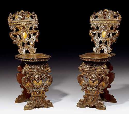 PAIR OF "SGABELLI" CHAIRS,Renaissance, Venice circa 1580. Pierced and carved walnut with female figures, masks, cartouches, flowers and leaves. Also partly gold painted. 45x48x52x117 cm. Provenance: Private collection, Lugano. A very rare pair in outstanding condition.
