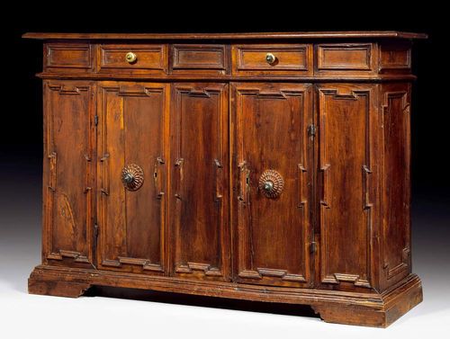 WALNUT CREDENZA,Renaisance, probably Tuscany, 17th century With architectural style front, 2 doors and drawers, with bronze mounts and knobs. With alterations. 174x50x120 cm. Provenance: Swiss private collection. Lit.: M. Cera, Il mobile italiano, Milan 1983; p. 35 (ill. 36, a very similar "credenza").