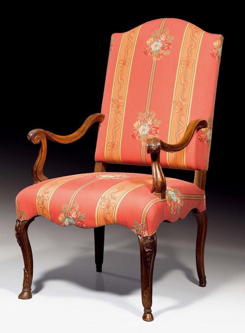 WALNUT ARMCHAIR,Louis XV, German circa 1760. Carved, with hoof feet and with red striped floral and foliate covers.  60x58x47x116 cm. Provenance: Private collection, Lugano.