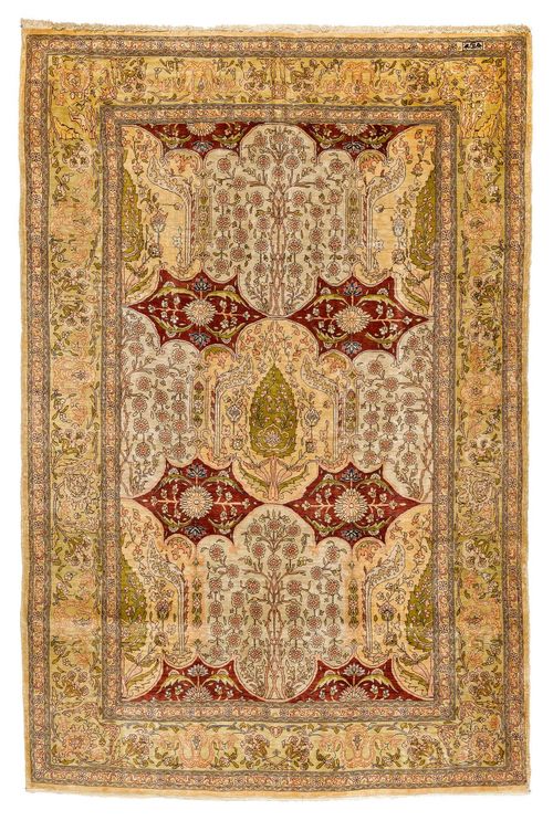 HEREKE SILK old.Central field in beige, yellow and red, finely patterned with plant motifs in harmonious colours, light green trim, slight wear, 100x153 cm.