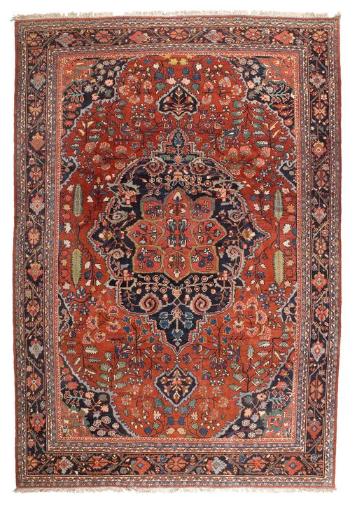 MAHAL antique.Red ground with a black central medallion and corner motifs, opulently patterned with plant motifs, black border, slight wear, 225x330 cm.