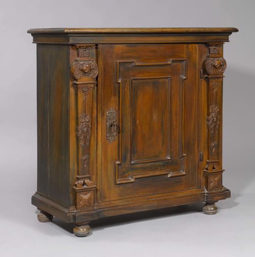 HALF-HEIGHT CABINET, Baroque style. Walnut, carved with winged angel heads and mascarons. 104x47x107 cm. 1 key.