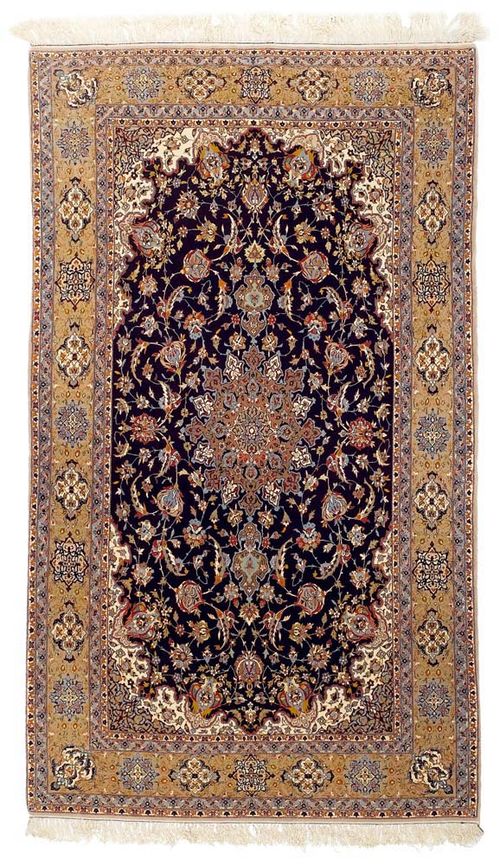 ISFAHAN old.Dark blue field with medallion. Patterned throughout with trailing flowers and palmettes. Beige border. Good condition, 260x150 cm.