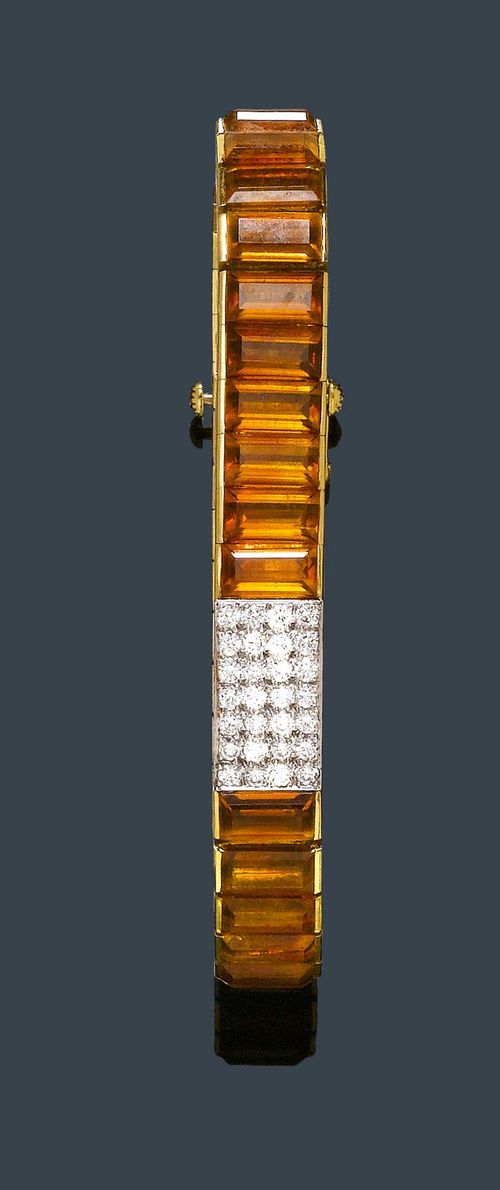CITRINE AND DIAMOND WRISTWATCH, LAYKIN et Cie. / BLANCPAIN , ca. 1950-1970. Yellow gold 750, watch cover in white gold. Decorative Rivière bracelet set throughout with 36 baguette-cut citrines weighing ca. 20.00 ct, the centre with a small rectangular watch with a cover set with brilliant-cut diamonds weighing ca. 0.50 ct. Case No. 10338. Crown on the back. Silver-coloured dial with gold-coloured numerals and hands. Hand winder, movement signed Blancpain Rayville SA, Movement No. 593531, Cal. R59. L ca. 17 cm.