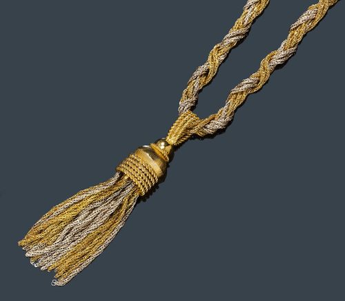 GOLD SAUTOIR. Yellow and white gold 750, 132g. Decorative bicolour chain with fantasy braid pattern and satin-finished clasp. The pendant consists of a tassel of gold chains, mounted on an ornamented and partially satin-finished half-spherical attache. L ca. 86 cm.