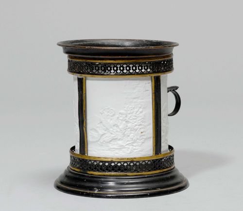 LITHOPHANE LAMP, 19th century. Round iron frame with open-worked bands and support ring. Inside: cylindrical biscuit with depictions of human figures. D 12.5 cm, H 15 cm.