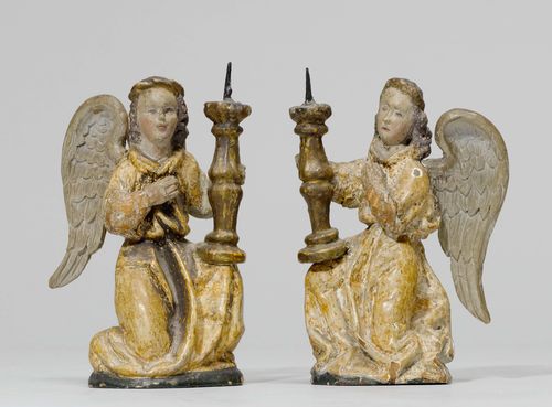PAIR OF CANDLESTICK ANGELS,late Gothic, South Germany, ca. 1510. Wood carved full round and painted. H 15 cm. Wings and lower arms, partially replaced. Painted over.