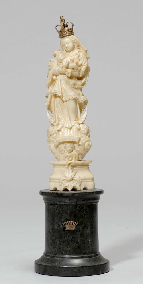 SMALL CRESCENT MOON MADONNA AND CHILD,Baroque, Italy, ca. 1700. Ivory, carved full round. Standing on a crescent moon and cloud base, carrying Baby Jesus. Mounted on a cylindrical stone plinth. H Madonna 16.5 cm. Crown, not original.