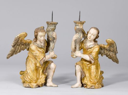 PAIR OF CANDLESTICKS WITH ANGELS,Baroque, Germany, 17th century. Wood, carved full round and painted. Both angels kneeling with a cornucopia-like candle holder. H 28 cm. Some losses, wings replaced in part. Provenance: Gut Aabach, Risch am Zugersee.