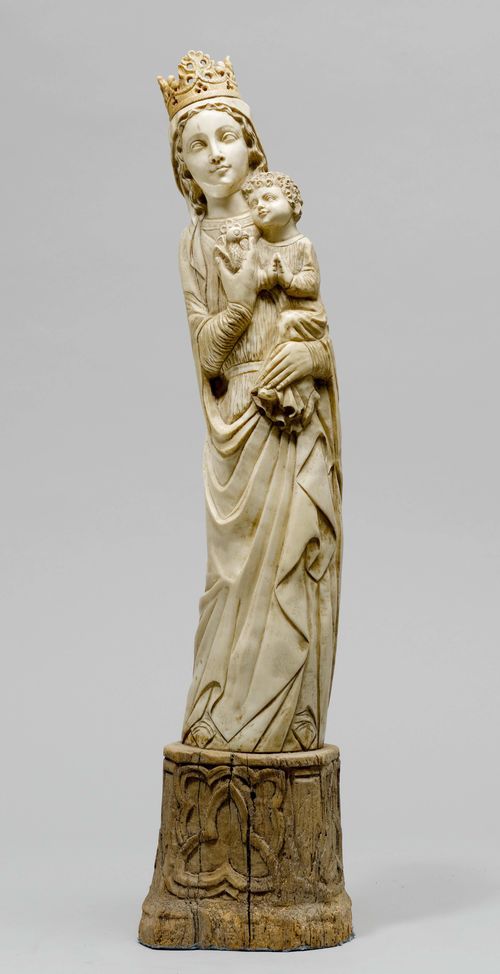 MADONNA AND CHILD,in the Gothic style, probably Goa, ca. 1900. Carved ivory. On a wooden plinth. H without base 55 cm. Crack.